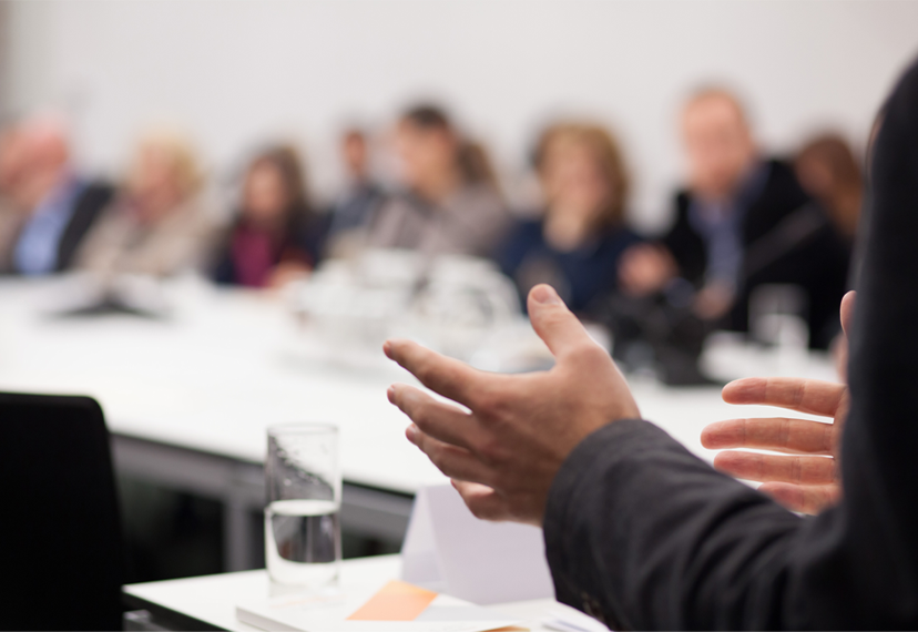 A diverse group of people at a meeting.