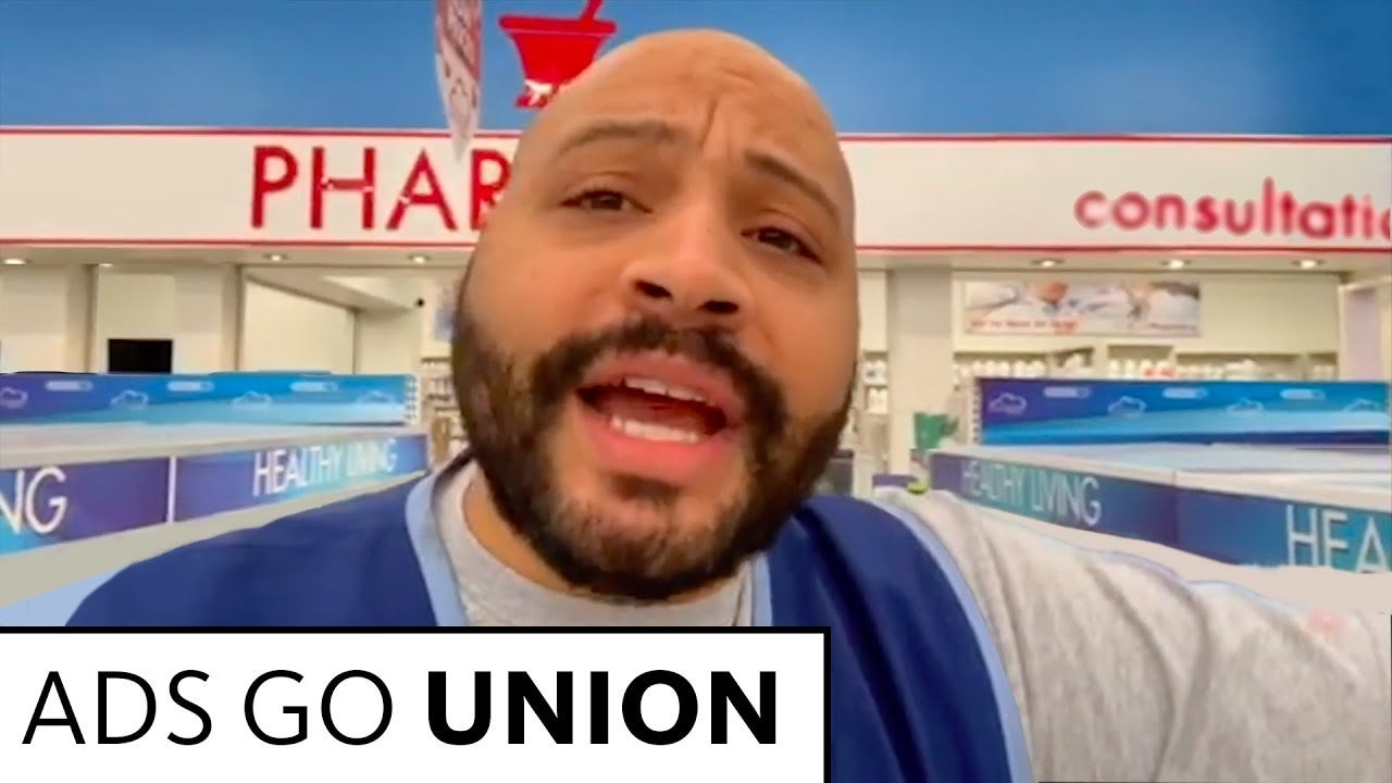 Dunn in blue vest from set of "Superstore" 