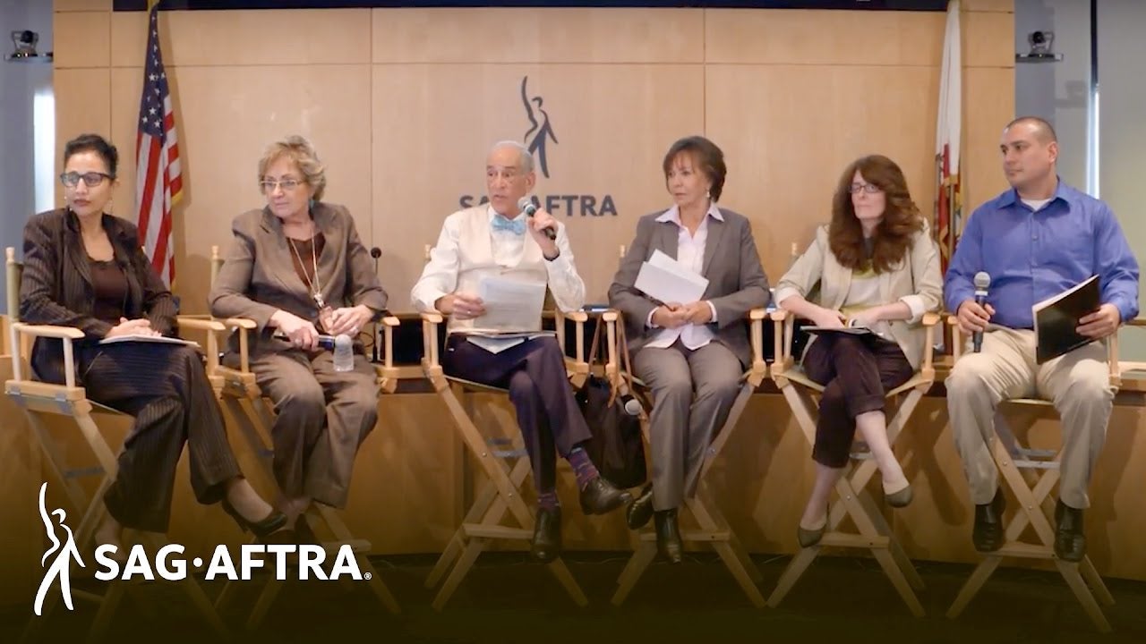 Row of actors/panelists looking out at audience