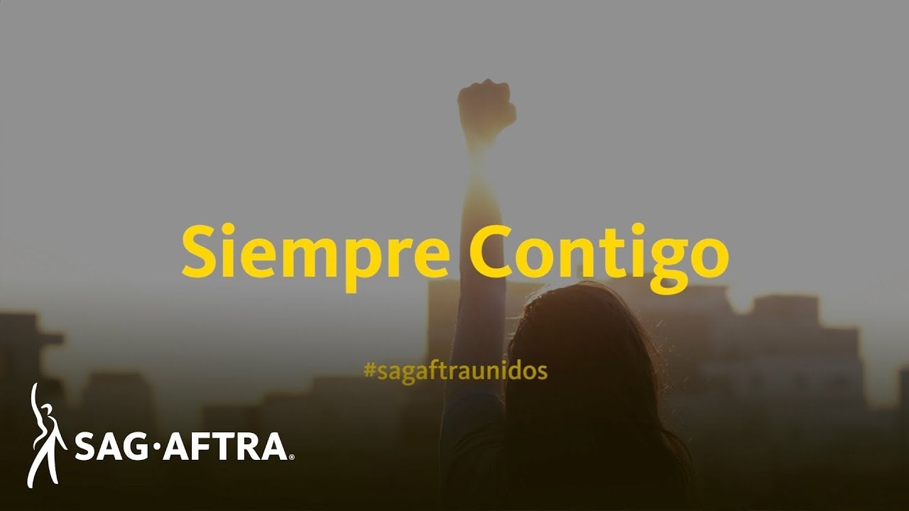 Siempre Contigo in yellow with #sagaftraunidos in yellow below. Background is a silhouette of a person holding up their fist