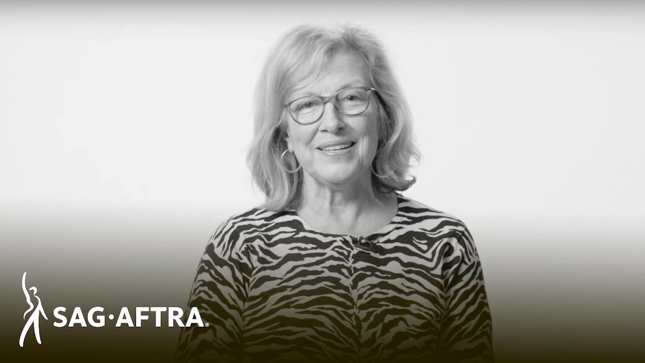 Black and white thumbnail of older woman in black and white patterned top