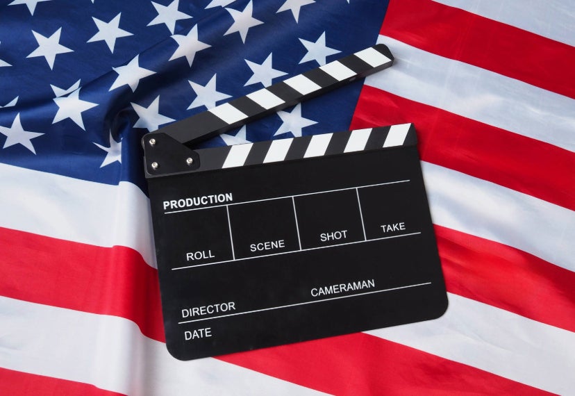 An American Flag with a director clapboard in the middle.