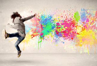 Neon paint splattered on a wall. 
