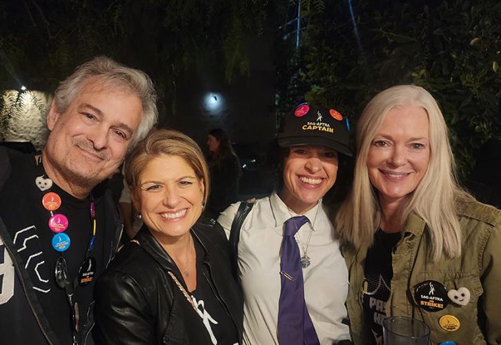 Ostrow, Cyrille, Phillips and Dulany smile while wearing their SAG-AFTRA gear.