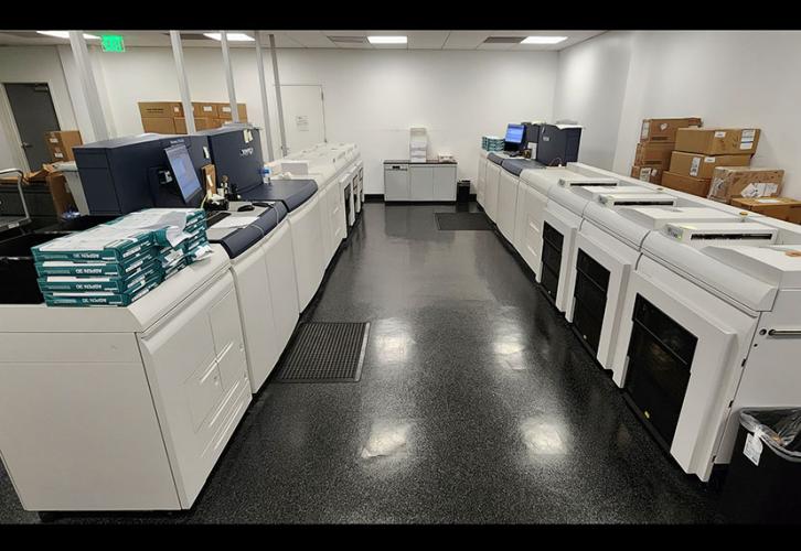 A Quadient mail machine folds the checks and statements, runs them through a postage meter and prepares them to mail. A scanner will then read the barcodes and checks and statements are inserted in envelopes.