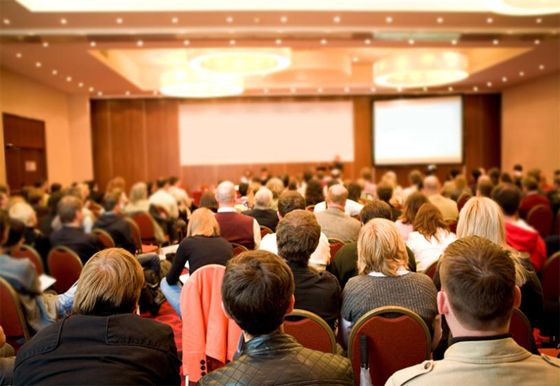 Photo of members at a meeting.