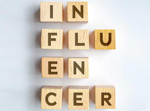 Influencers in block letters