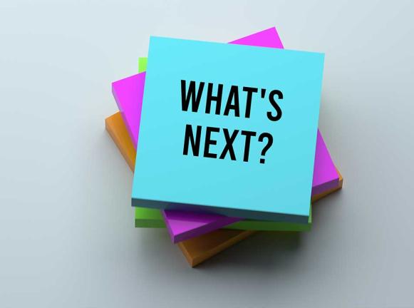 Stack of post-its with "What's Next" on top post it