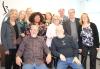 A diverse group of men and women sit with Mark Wenner, front row left, and Bill Wax, front row right. Wenner and Wax are seated. A diverse group of men and women sit with Mark Wenner, front row left, and Bill Wax, front row right. Wenner and Wax are seated.