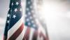 SAG-AFTRA Closed Monday, Nov. 11 American flag draped from a pole w/ other American flags blurred in the background