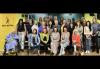 Members enjoyed themselves at the membership meeting. A few dozen members pose for a photo, some sitting, some standing. A woman in a wheelchair is one the left, under the SAG-AFTRA logo.