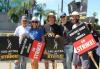 The cast, writers and crew for the NCIS universe stand with picket signs at the Paramount picket lines on Aug. 2.