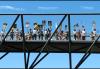 SAG-AFTRA members, family and friends on a pedestrian bridge during the picket at NBCUniversal. Photo by Jack E. Herman. SAG-AFTRA members, family and friends on a pedestrian bridge during the picket at NBCUniversal. Photo by Jack E. Herman.