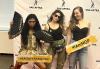 SAG-AFTRA New York Local members and their guest pose with New York NextGen Performers Co-Chair Sarah Seeds, center. Three people stand in front of a white step-and-repeat that reads Sag-Aftra in black text. They are holding yellow and white signs that say #SagAftraMember and #IAmNGP in black text.