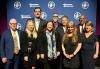 Labor leaders at the New Jersey State AFL-CIO Labor Awards held on June 11 at the Hard Rock Hotel & Casino in Atlantic City, New Jersey. A group of nine people stand in two rows in front of a blue backdrop with the New Jersey State AFL-CIO logo in white.
