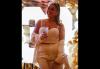 Rachel Viggiano is smiling, dressed in white and is holding a drink. A brightly lit "30" can be seen behind her.