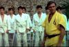 SAG-AFTRA Statement on the Passing of John Saxon Saxton in yellow gi with others in the background in white gi