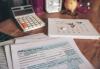 Performing Artist Tax Parity Act (PATPA) Image of tax forms with a calculator and calendar on a desk.