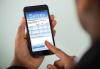 Complete the SAG-AFTRA Survey Image of a person holding a phone with a Survey on the screen.