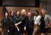 From left, casting director Wendy Kurtzman, SAG-AFTRA member Melanie Mayron, Los Angeles Local President Jodi Long, Conservatory Intensive Subcommittee Chair Lee Garlington, Producer Matt Johnson, SAG-AFTRA members Diarra Kilpatrick and Lizza Monet Morales speak about the “new normal” in the industry at the opening night reception for the 2024 Conservatory Intensive. Five individuals pose wearing various clothing styles with an American flag to the left and a California flag to the right of a wood paneled background.