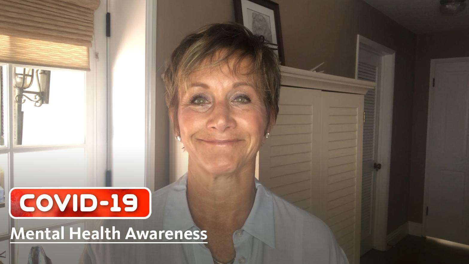 President Gabrielle Carteris on the Importance of Mental Wellness Carteris in white button up smiling with window over right shoulder and dressers over her left shoulder. Layered on top is "COVID-19" logo in red bubble with "Mental Health Awareness" in white below covid logo
